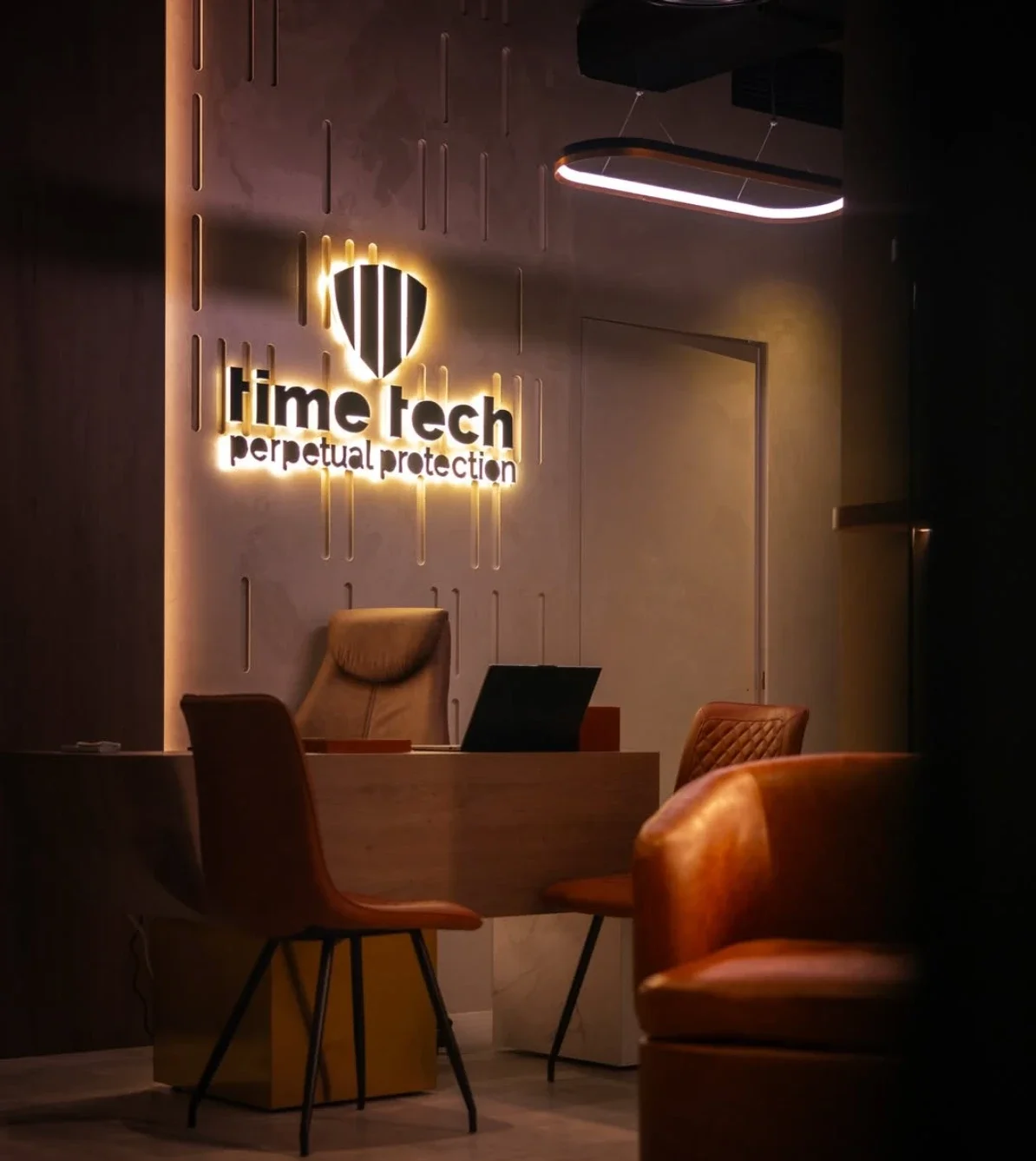 The Time Tech reception at Shiekha Tower, with the lit logo wall